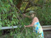 Annette cuts fishing pole